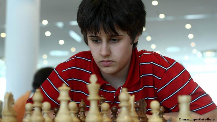 Filiz Osmanodja at age 12, a young girls stares at a chess board