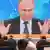 Russlands Präsident Wladimir Putin auf einer Videoleinwand während der Pressekonferenz zum Jahresende