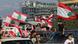 Beirut locals in cars, wave flags, as they mark the one-year anniversary of Lebanese anti-government protests. Beirut locals in cars, wave flags, as they mark the one-year anniversary of Lebanese anti-government protests.