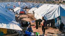 December 19, 2020***
A migrant couple hang out their laundry outside their tent, in the new refugee camp of Kara Tepe, in the island of Lesbos, on December 19, 2020. (Photo by Anthi PAZIANOU / AFP) (Photo by ANTHI PAZIANOU/AFP via Getty Images)