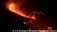 In this photo provided by the U.S. Geological Survey, lava flows within the Halema’uma’u crater of the Kilauea volcano Sunday, Dec. 20, 2020. The Kilauea volcano on Hawaii’s Big Island has erupted, the U.S. Geological Survey said. (U.S. Geological Survey via AP)