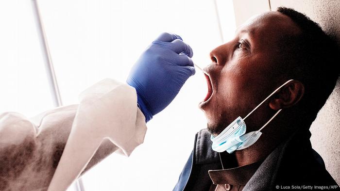 A man passes a swab in Johannesburg