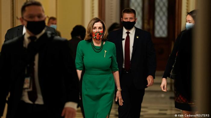 Nancy Pelosi walking inside the US Capitol Building