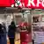 People in Japan's Yokohama wait in line at KFC