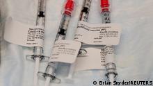 Doses of the Pfizer-BioNTech coronavirus disease (COVID-19) vaccine are ready to be administered at Brigham and Women's Hospital in Boston, Massachusetts, U.S., December 16, 2020. REUTERS/Brian Snyder 