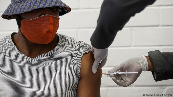  A volunteer receives an injection from a medical workerl in Soweto, South Africa