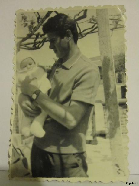 Georgi Gospodinov as an infant being held by his father