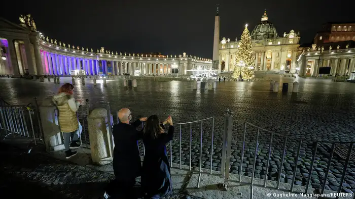 People pray outside St. Peter's square in Vatican City