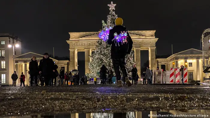 A lit up Christmas tree near the Brandenburg Gate in Berlin