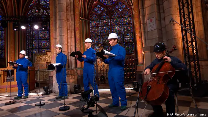 Choir members sing in Notre Dame cathedral