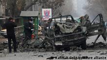 Afghan security personnel inspect the site of a bomb attack in Kabul, Afghanistan, Saturday, Dec. 26, 2020. A series of explosions hit the Afghan capital on Saturday morning. (AP Photo/Rahmat Gul)