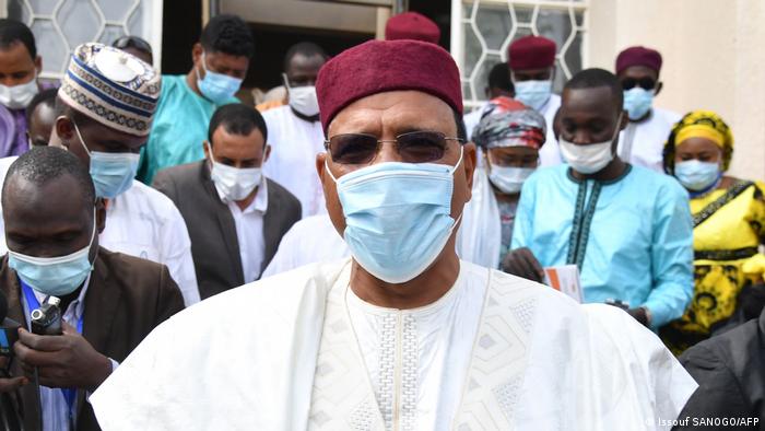 Presidential candidate Mohamed Bazoum at a voting station in Niger wearing a mask