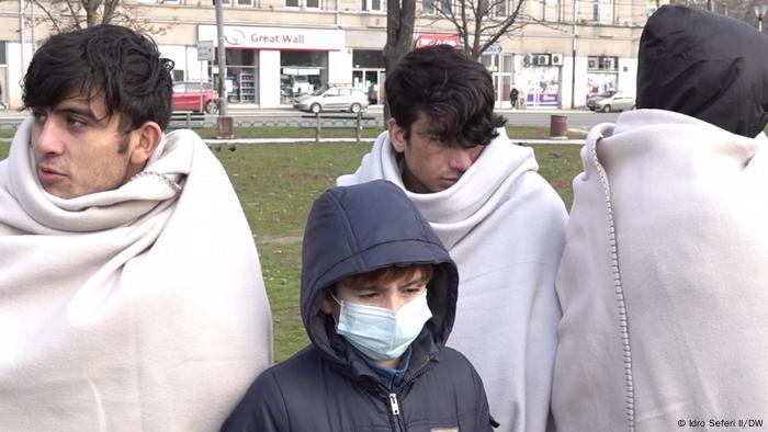 Young refugees in blankets in Belgrade