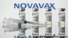 An illustration picture shows vials with Covid-19 Vaccine stickers attached and syringes with the logo of US biotech company Novavax, on November 17, 2020. (Photo by JUSTIN TALLIS / AFP) (Photo by JUSTIN TALLIS/AFP via Getty Images)