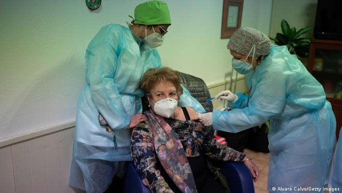 An elderly woman receives one of the first Pfizer/BioNTech Covid-19 vaccines in Spain at the Somontano nursing home on 27 December 2020 in Barbastro, Spain