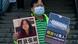 A pro-democracy protester displays a placard with the journalist's photo A pro-democracy protester displays a placard with the journalist's photo