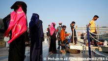 Rohingyas prepare to board a ship as they move to Bhasan Char island near Chattogram, Bangladesh, December 29, 2020. REUTERS/Mohammad Ponir Hossain