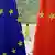 A woman walks past the flags of the EU and China in Beijing