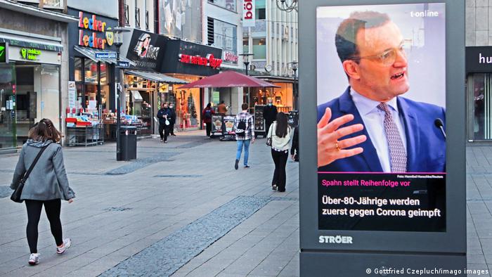 A billboard featuring Health Minister Jens Spahn