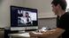 student at desk, participating in zoom conference with other students on his computer student at desk, participating in zoom conference with other students on his computer