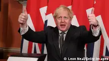 LONDON, ENGLAND - DECEMBER 30: Prime Minister, Boris Johnson gives a thumbs up gesture after signing the Brexit trade deal with the EU in number 10 Downing Street on December 30, 2020 in London, United Kingdom. The United Kingdom and the European Union agreed a Trade and Cooperation Agreement, an Agreement on Nuclear Cooperation and an Agreement on Security Procedures for Exchanging and Protecting Classified Information on Christmas Eve 2020. These Agreements change the basis of the UK's relationship with the EU from EU law to free trade and friendly cooperation. In a referendum of 23 June 2016 the British people voted to take back control of their laws, borders, money, trade and fisheries, commonly referred to as Brexit. (Photo by Leon Neal/Getty Images)