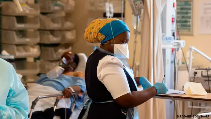 A nurse takes notes in a South African hospital