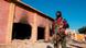 A policeman stands guard at the burnt Hindu temple a day after a mob attack in a remote village in Karak district A policeman stands guard at the burnt Hindu temple a day after a mob attack in a remote village in Karak district