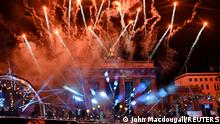 Fireworks explode over Berlin's landmark Brandenburg Gate to usher in the new year during a concert 'Willkommen 2021' (Welcome 2021) amid coronavirus disease (COVID-19) restrictions in Berlin, Germany January 1, 2021. John Macdougall/Pool via REUTERS