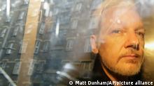 FILE - In this Wednesday May 1, 2019 file photo buildings are reflected in the window as WikiLeaks founder Julian Assange is taken from court, where he appeared on charges of jumping British bail seven years ago, in London. Assange relayed how he “binge-watched” the suicide of the former Bosnian Croat general in a U.N. courtroom three years ago, a doctor who visited the WikiLeaks founder on several occasions while he was in the Ecuadorian Embassy in London told an extradition hearing Thursday, Sept. 24, 2020. (AP Photo/Matt Dunham, File) |