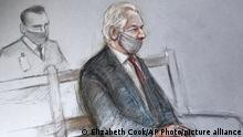 This is a court artist sketch by Elizabeth Cook of Julian Assange appearing at the Old Bailey in London for the ruling in his extradition case, in London, Monday, Jan. 4, 2021. A British judge has rejected the United States’ request to extradite WikiLeaks founder Julian Assange to face espionage charges, saying it would be “oppressive” because of his mental health. District Judge Vanessa Baraitser said Assange was likely to kill himself if sent to the U.S. The U.S. government said it would appeal the decision. (Elizabeth Cook/PA via AP)