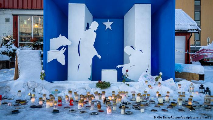 A Nativity scene in Ask with candles burning in front of it
