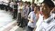 A group of company staff members stand at the Foxconn complex in the southern Chinese city of Shenzhen, Southern city in China, Wednesday, May 26, 2010. The head of the giant electronics company whose main facility in China has been battered by a string of worker suicides opened the plant's gates to scores of reporters Wednesday, hours after saying that intense media attention could make the situation worse. (AP Photo/Kin Cheung) A group of company staff members stand at the Foxconn complex in the southern Chinese city of Shenzhen, Southern city in China, Wednesday, May 26, 2010. The head of the giant electronics company whose main facility in China has been battered by a string of worker suicides opened the plant's gates to scores of reporters Wednesday, hours after saying that intense media attention could make the situation worse. (AP Photo/Kin Cheung)