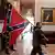 A supporter of President Donald Trump carries a Confederate battle flag on the second floor of the U.S. Capitol