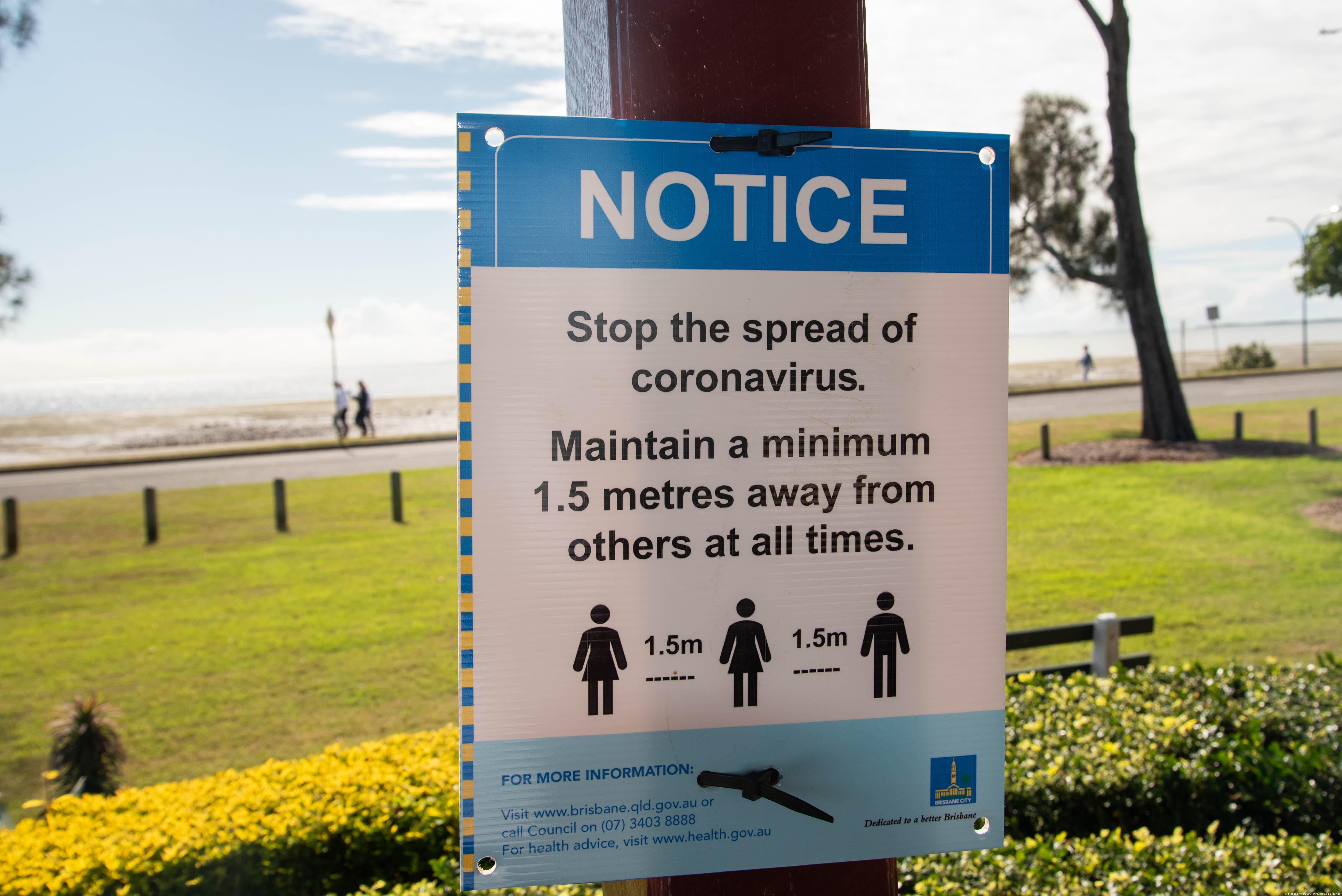 A sign in Brisbane, Australia reminds the public about social distancing 