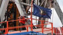 FILE—In this file photo from March 12, 2020, the flag of the Commonwealth of Pennsylvania flies on the drilling rig as work continues at a shale gas well drilling site in St. Mary's, Pa. Pennsylvania attorney general Josh Shapiro is scheduled to release results on Thursday June 25, 2020 of a grand jury investigation into natural gas hydraulic fracturing. The fracking process has raised environmental concerns while turning the state into a major energy producer. (AP Photo/Keith Srakocic, File)