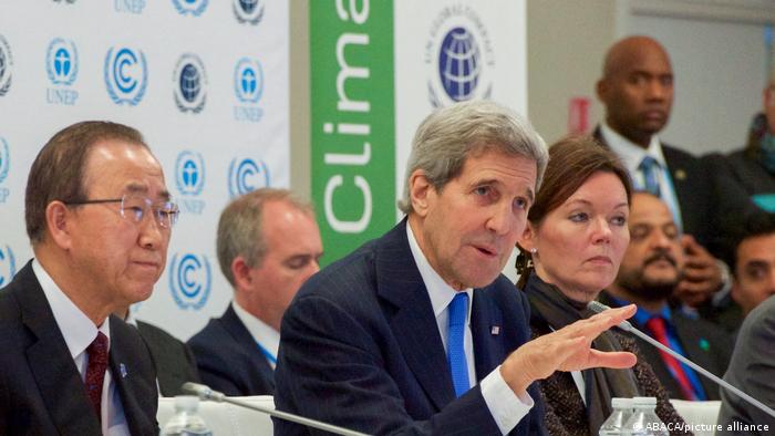 US former Secretary of State John Kerry signing the Paris Agreement
