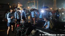 JAKARTA, INDONESIA - JANUARY 09: Indonesian elite navy divers prepare their gear for for the search and rescue operation for Sriwijaya Air flight SJ 182, which lost contact with air controllers shortly after take-off, on January 09, 2021 in Jakarta, Indonesia. Sriwijaya Air flight SJY182, carrying 62 people on board a flight from Indonesia's capital to Pontianak, Indonesia, lost contact with air controllers shortly after take-off and is believed to have crashed into the waters off the coast of Jakarta. (Photo by Ed Wray/Getty Images)