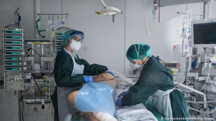 Nurses look after a COVID-19 patient in Essen, Germany