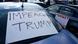 An Impeach Trump sign on car window An Impeach Trump sign on car window
