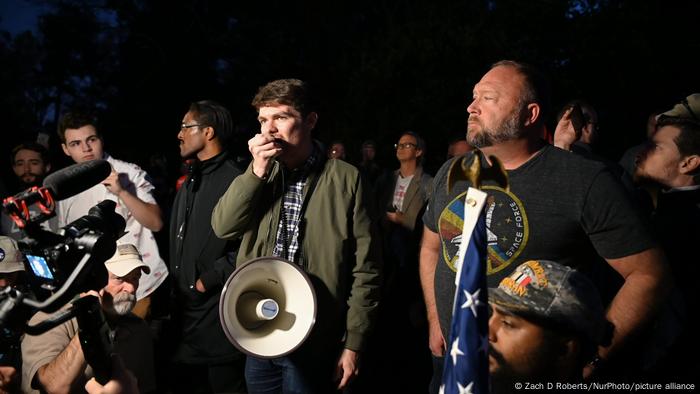 Nick Fuentes with megaphone at a nightly Stop the Steal movement rally in Georgia amid other protesters