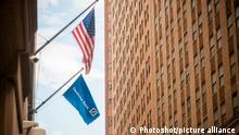A flag flies outside the Deutsche Bank headquarters on Wall Street in Lower Manhattan in New York on Monday, October 17, 2016.