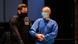 Yves R. being brought into court by a police officer Yves R. being brought into court by a police officer