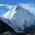K2 summit seen before a blue sky