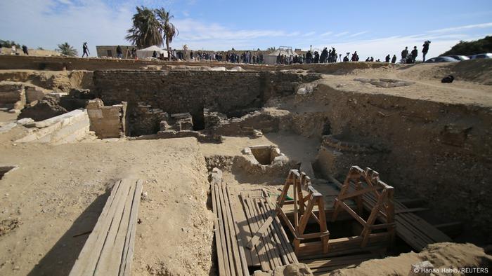 Looking into the excavation pit, including wooden structures over shafts