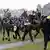 Police on horseback tackled protesters in Amsterdam