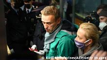 Russian opposition leader Alexei Navalny and his wife Yulia are seen at the passport control point at Moscow's Sheremetyevo airport on January 17, 2021. - Russian police detained Kremlin critic Alexei Navalny at a Moscow airport shortly after he landed on a flight from Berlin, an AFP journalist at the scene said. (Photo by Kirill KUDRYAVTSEV / AFP) (Photo by KIRILL KUDRYAVTSEV/AFP via Getty Images)