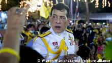 Thai King Maha Vajiralongkorn gestures as he meets supporters in Bangkok, Thailand, Sunday, Nov. 1, 2020. Under increasing pressure from protesters demanding reforms to the monarchy, Thailand's king and queen met Sunday with thousands of adoring supporters in Bangkok, mixing with citizens in the street after attending a religious ceremony inside the Grand Palace. (AP Photo/Wason Wanichakorn)
