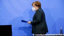 German Chancellor Angela Merkel arrives to attend a news conference about further coronavirus disease (COVID-19) measures, at the Chancellery in Berlin, Germany, January 19, 2021. REUTERS/Hannibal Hanschke/Pool