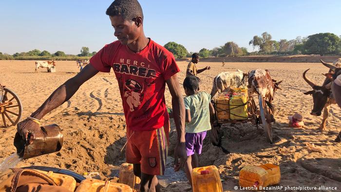 Men dig for water in the dry Mandrare river bed, in Madagascar