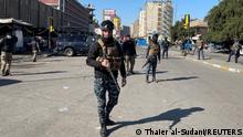 Iraqi security forces keep guard the site of a suicide attack in Baghdad, Iraq January 21, 2021. REUTERS/Thaier al-Sudani